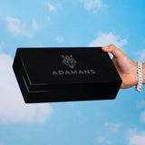 Premium Adamans Box luxury black jewellery storage box held against blue sky background