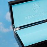 Premium Adamans Box luxury jewelry storage with elegant blue interior and sleek black exterior against sky background