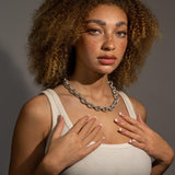 Woman wearing 15mm Rolo Link chain in white gold with 1mm stones and PVD vacuum plating