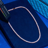 3mm rose gold tennis chain with round cut prong-lifted stones on blue velvet display
