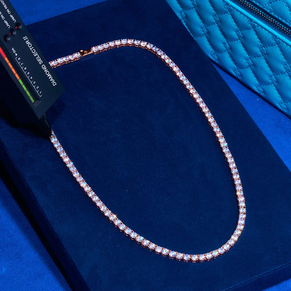3mm rose gold tennis chain with round cut prong-lifted stones on blue velvet display
