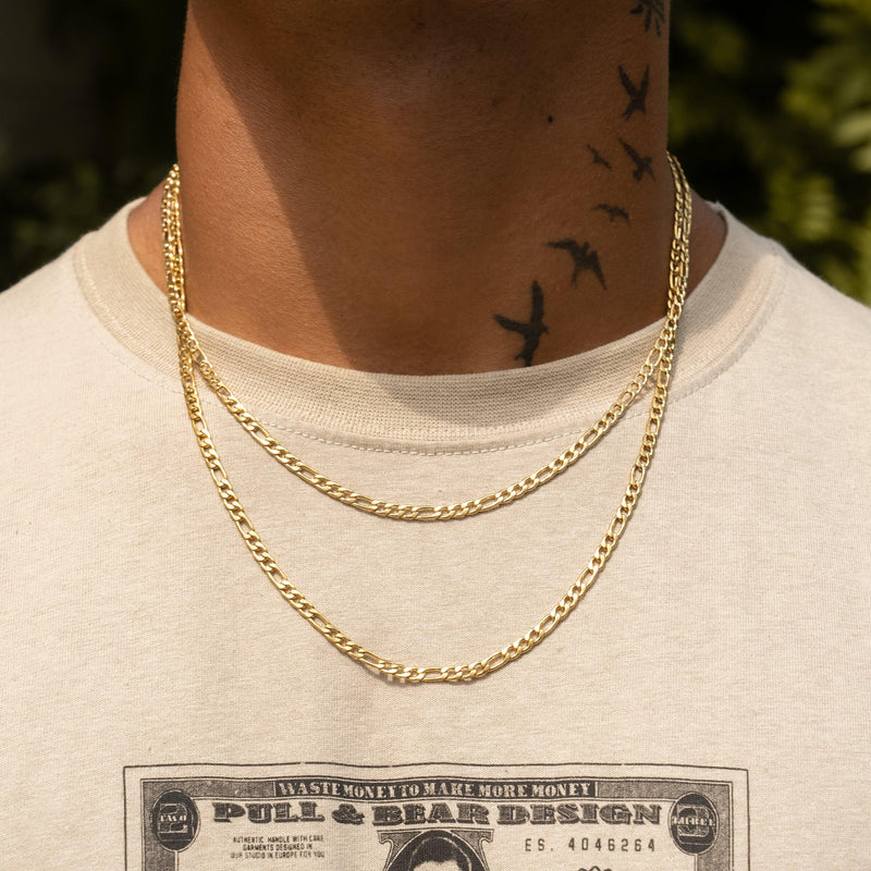 4mm Figaro Chain in gold on person, featuring 18K PVD plated stainless steel.