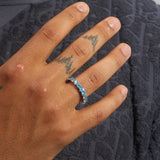 hand wearing 5mm blue diamond ring with 18K gold plating and round cut stones
