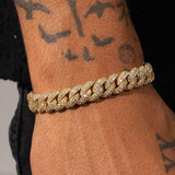 8mm Moissanite Cuban Link bracelet in 18k gold vermeil with VVS1 D colour stones on wrist