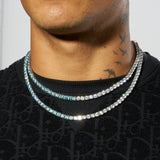 5mm pale blue and white tennis chain in white gold with flawless diamond simulants styled on male model.