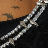 5mm PAVE SPIKE TENNIS CHAIN in white gold with round cut stones and spike accents.