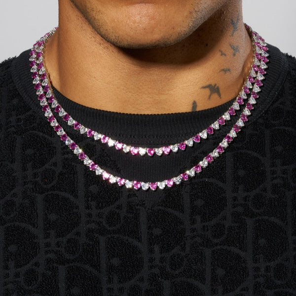 5mm white and pink heart tennis chain in white gold, worn on neck, premium shine.