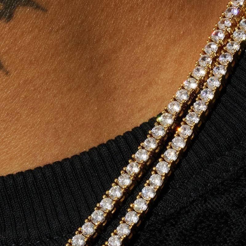 3mm lab diamond tennis chain in 18k vermeil, worn against a black background.