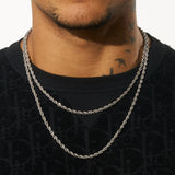 4mm white gold rope chain necklace on person wearing black top.