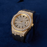 44mm paved VVS moissanite gold watch with black silicone band on blue cushion