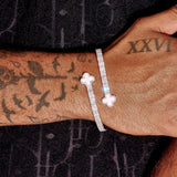 8MM Moissanite pink motif baguette bangle in white gold plated 925 silver worn on tattooed wrist