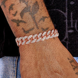 10mm iced Cuban bracelet in rose gold with diamond simulants on wrist
