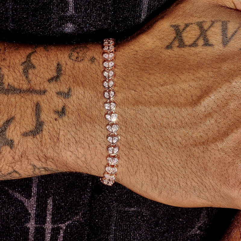 4mm Moissanite Broken Heart Bracelet in rose gold plated 925 silver worn on wrist with tattoos