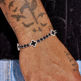 5MM black four leaf clover tennis bracelet in white gold on wrist