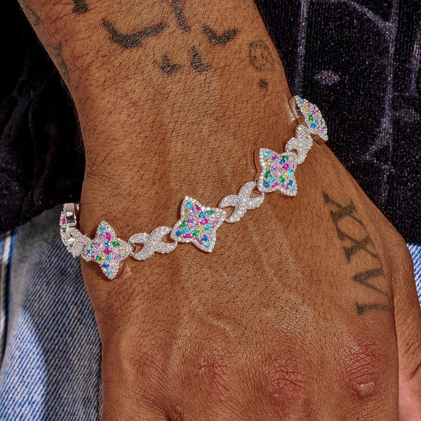 Multicolor Cuban bracelet in white gold with vibrant gemstone stars on wrist