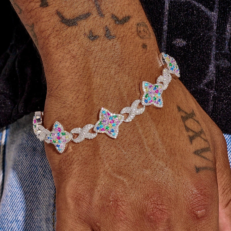 Multicolor Cuban bracelet in white gold with vibrant gemstone stars on wrist