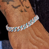 10mm iced Cuban bracelet with two tone white and blue CZ stones on wrist
