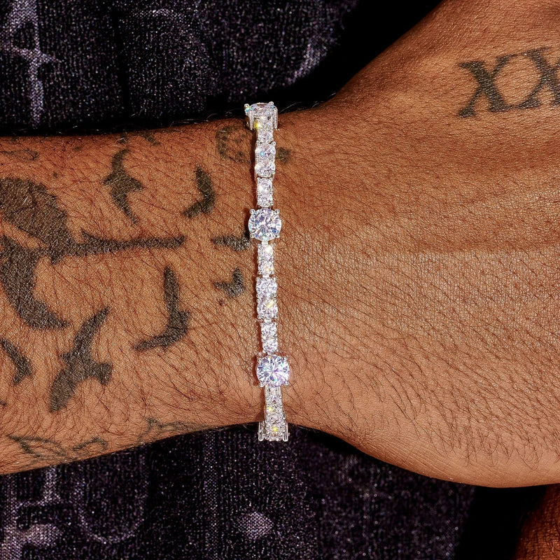Gem Stationed Tennis Bracelet in white gold with evenly placed sparkling gems on wrist