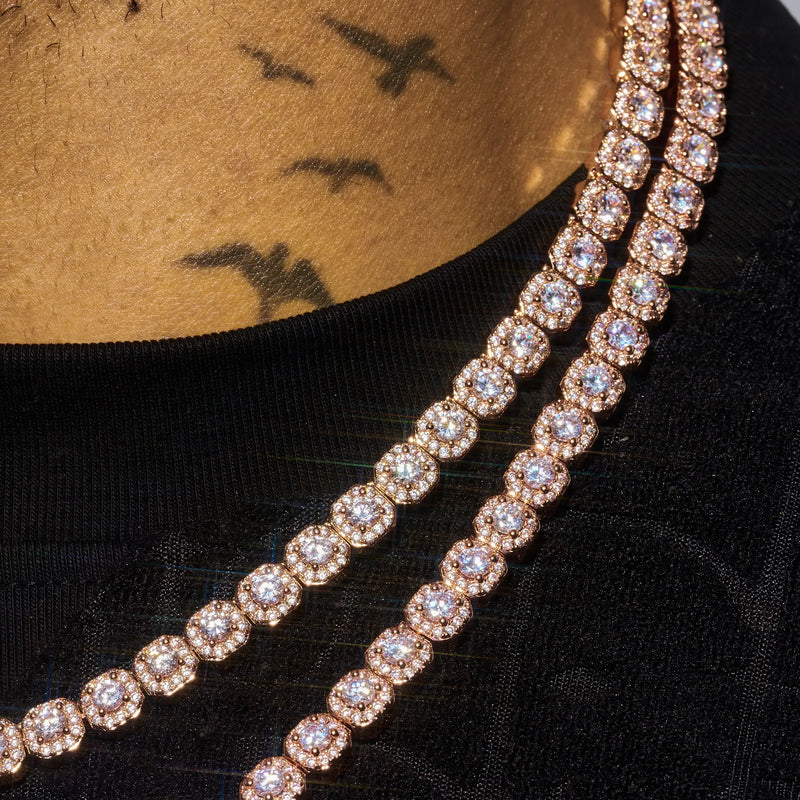 Rose gold micro moissanite clustered tennis chain necklace on person with bird tattoos and black shirt