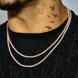 Close-up of a person wearing double-layered 3mm Moissanite tennis chains in rose gold with sparkling VVS1 clarity stones on a black shirt