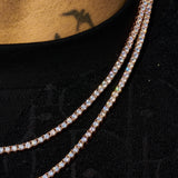 3mm rose gold tennis chain with round cut stones on black shirt neckline