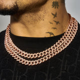 13mm rose gold moissanite Cuban chain on male neck with black shirt and neck tattoos
