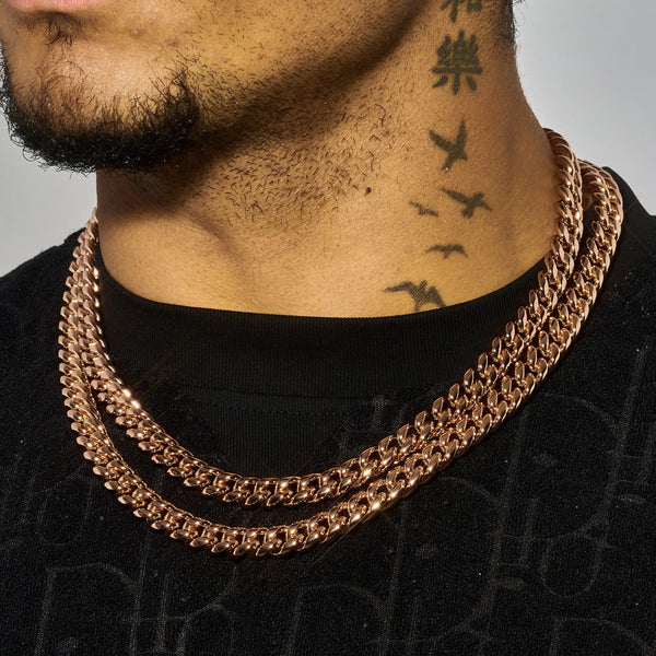10mm rose gold moissanite Cuban chain necklace on male model with neck tattoos and black shirt