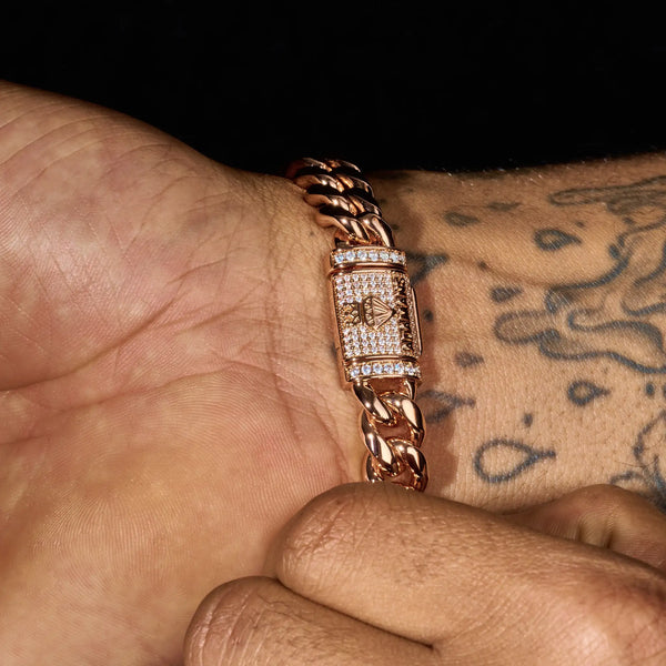 Rose gold 10mm Moissanite Cuban iced clasp bracelet on wrist with tattoo background