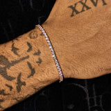 3mm moissanite tennis bracelet in rose gold on wrist with tattoos