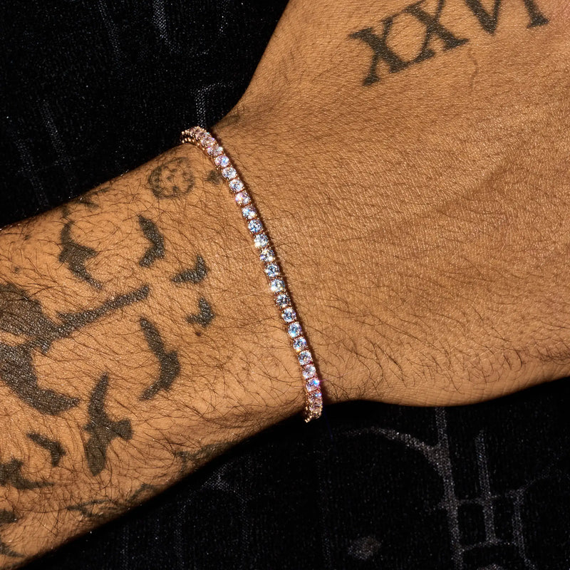 3mm moissanite tennis bracelet in rose gold on wrist with tattoos