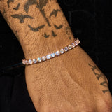 5mm rose gold tennis bracelet with sparkling round cut stones on wrist