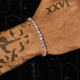5mm moissanite tennis bracelet in rose gold on tattooed wrist sparkling bright