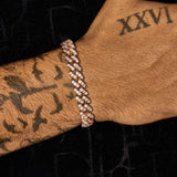 13mm rose gold moissanite iced cuban link bracelet on wrist