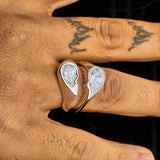 Broken Heart Ring in white gold with flawless diamond simulants worn on finger