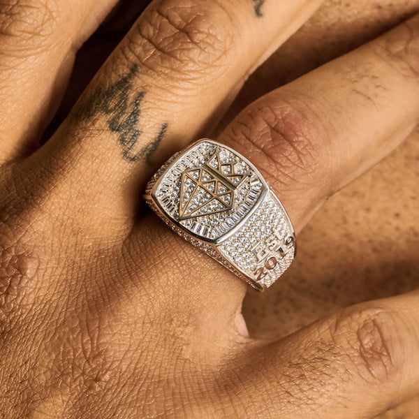 Moissanite Adamans Ring 925 silver baguette iced-out design with signature logo on finger