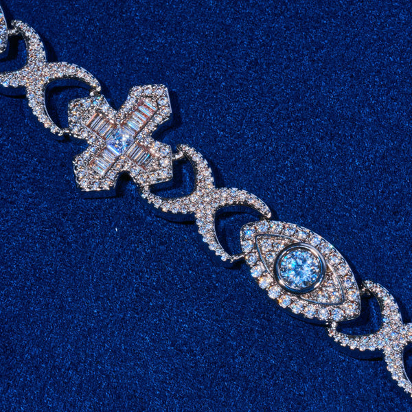 Close-up of Moissanite Baguette Cross Evil Eye Chain in 925 silver with baguette-cut stones and evil eye motif on blue background