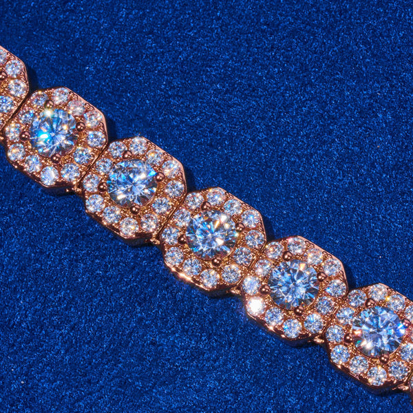 close-up of 10mm clustered tennis chain in rose gold with sparkling diamond simulants on blue background
