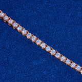 3mm rose gold tennis chain with round cut diamond simulant stones on blue background