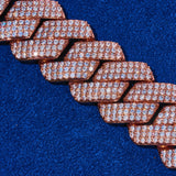 20mm Monaco Chain rose gold with hand-set sparkling stones on blue background