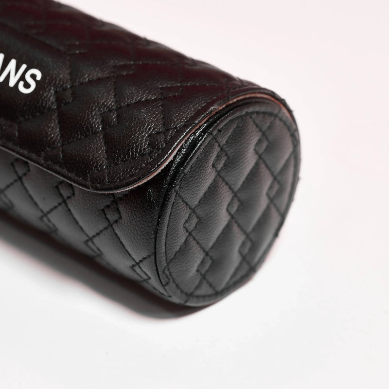 black premium top grain leather travel watch roll with quilted design and adjustable strap