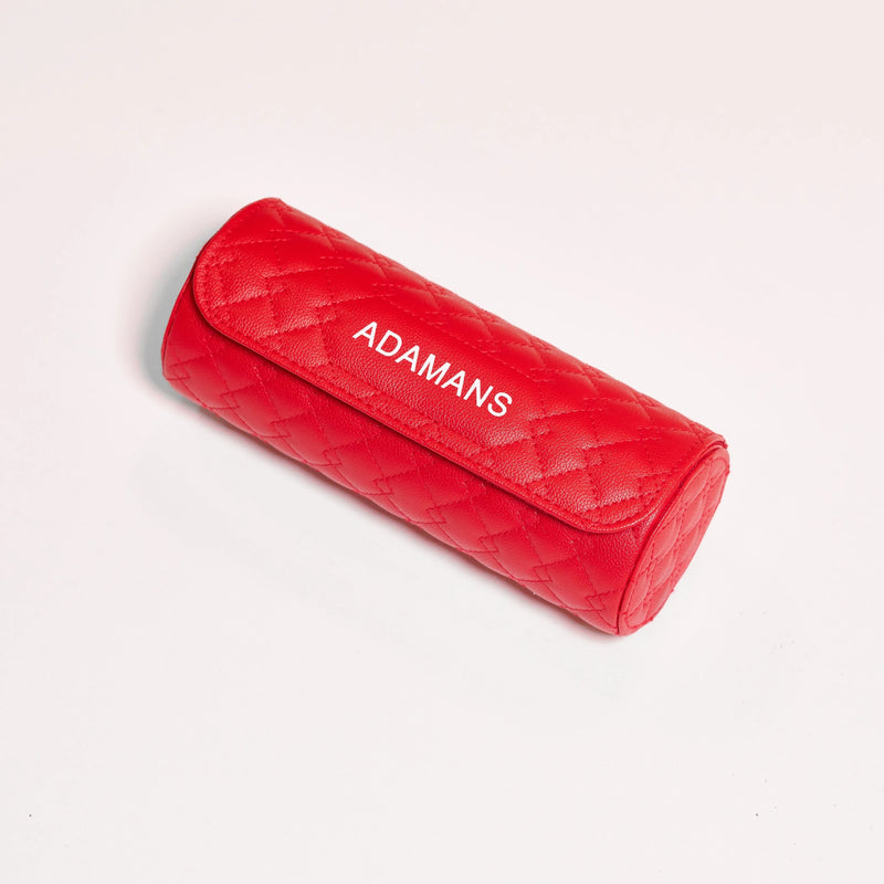 Red leather travel watch roll with quilted design and ADAMANS logo
