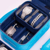 blue small leather travel jewellery case with ultra suede trays holding watch bracelet and eyewear