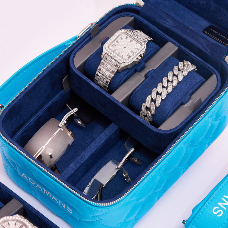 blue small leather travel jewellery case with ultra suede trays holding watch bracelet and eyewear