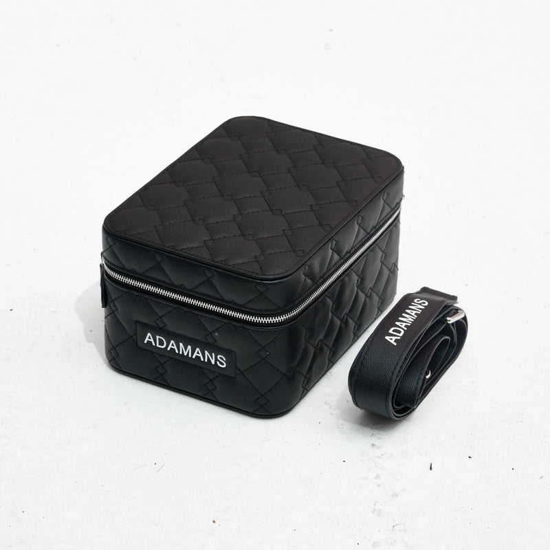Black small leather travel jewellery case with adjustable strap and quilted design by Adamans