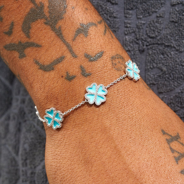 Tiffany Blue Clover Bracelet in 925 Silver with diamond simulants on wrist.