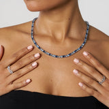 5mm Tri-Blue Diamond white gold tennis chain necklace worn on model with matching rings
