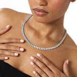 5mm pale blue and white tennis chain necklace in white gold worn on neck