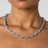 Close-up of 8mm iced infinity chain necklace in white gold on neck