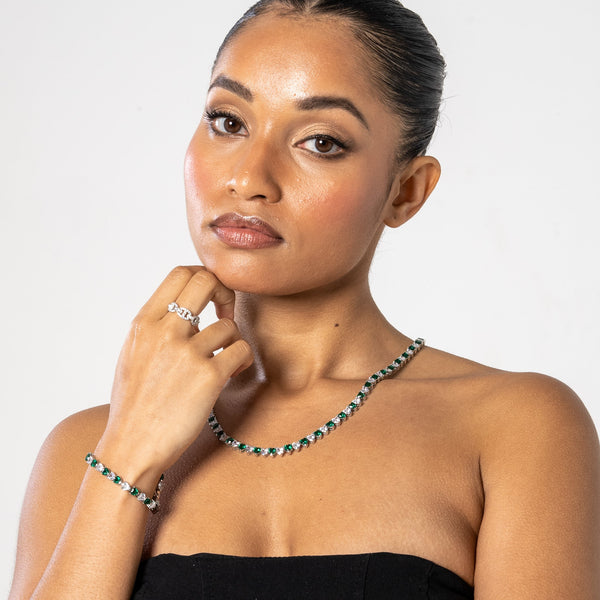 5mm white and green heart tennis chain necklace and bracelet set in white gold worn by woman