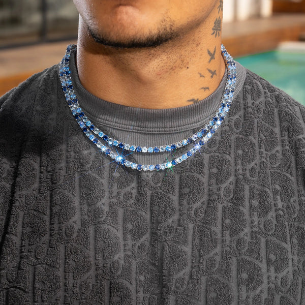 5mm Moissanite Tri-Blue Diamond Tennis Chain in 925 Silver on model with textured shirt.